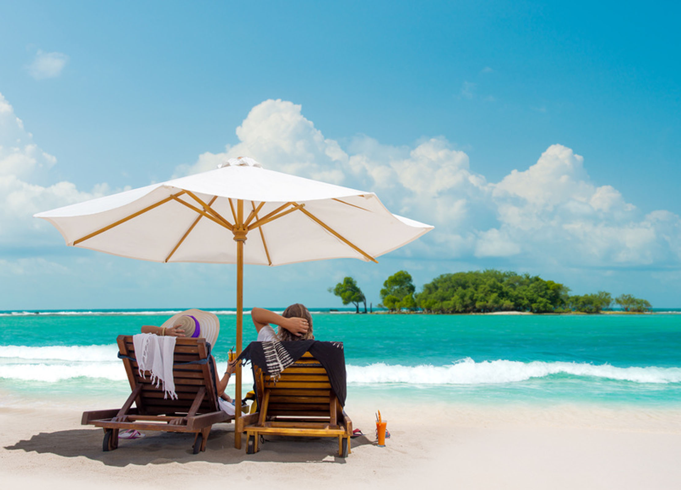 Couple on the beach in Bali Indonesia on their honeymoon