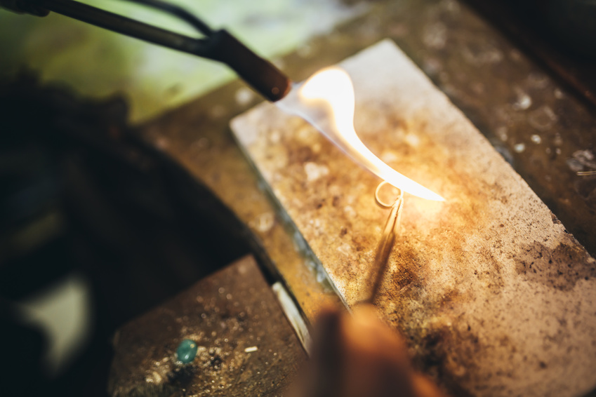 Goldsmith making a ring the traditional way