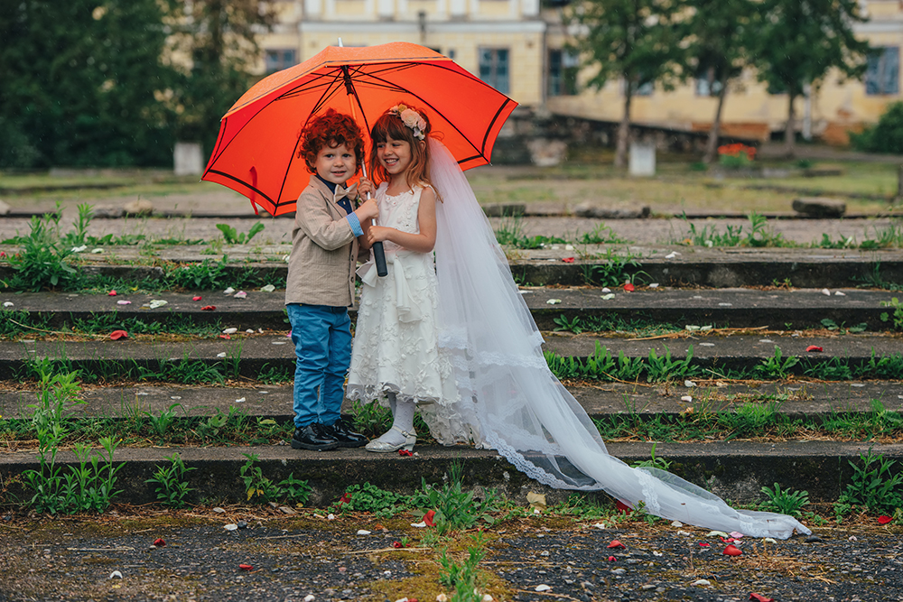 photo of two funny little bride and groom