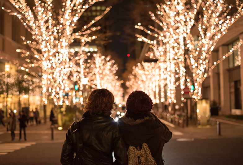 Asian couple with Christmas lights in Marunouchi, Tokyo
