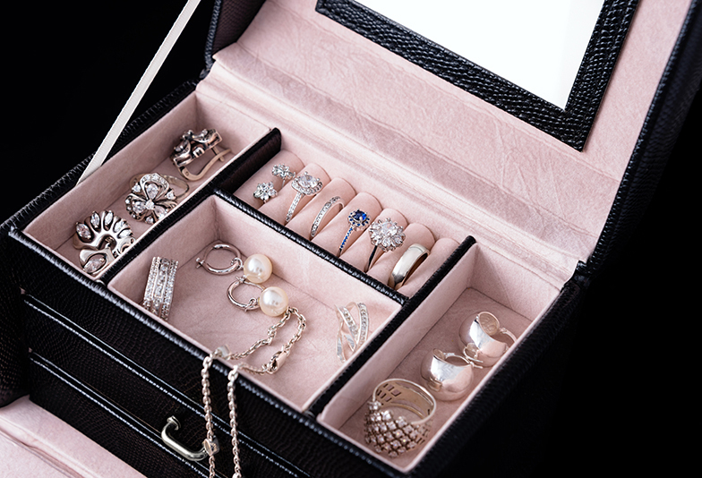 Jewelry box with white gold and silver rings, earrings and pendants with pearls. Collection of luxury jewelry