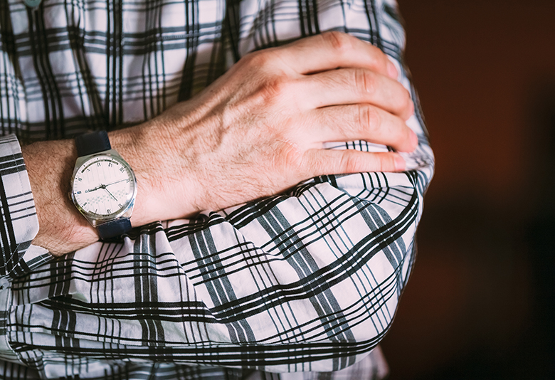 Close Up Vintage Old Watch On Man Hand. Men Wear In Striped Shirt