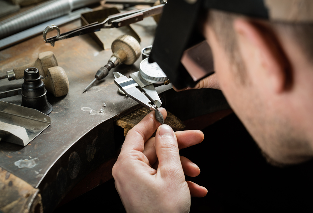 Craft jewellery making. Measuring of the size of the diamond.